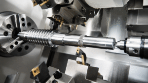 CNC turning process on a lathe machining a cylindrical metal part