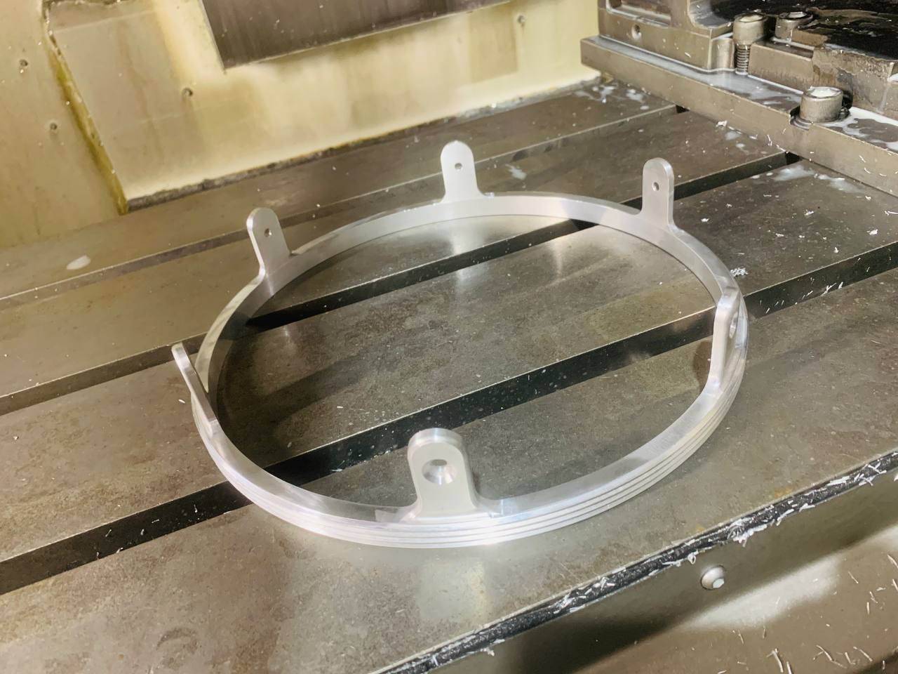 precision machined metal ring hoop component with mounting tabs by Sharma Technocast India
